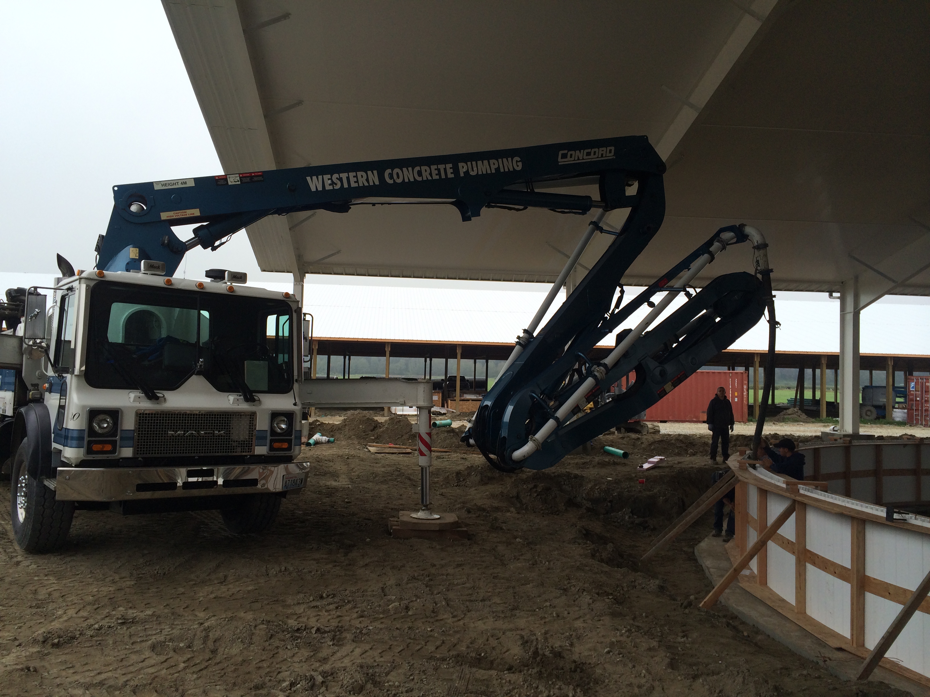 32 Z Boom is scrunched up to pour walls for a new milking carousel in Stanwood, WA.  